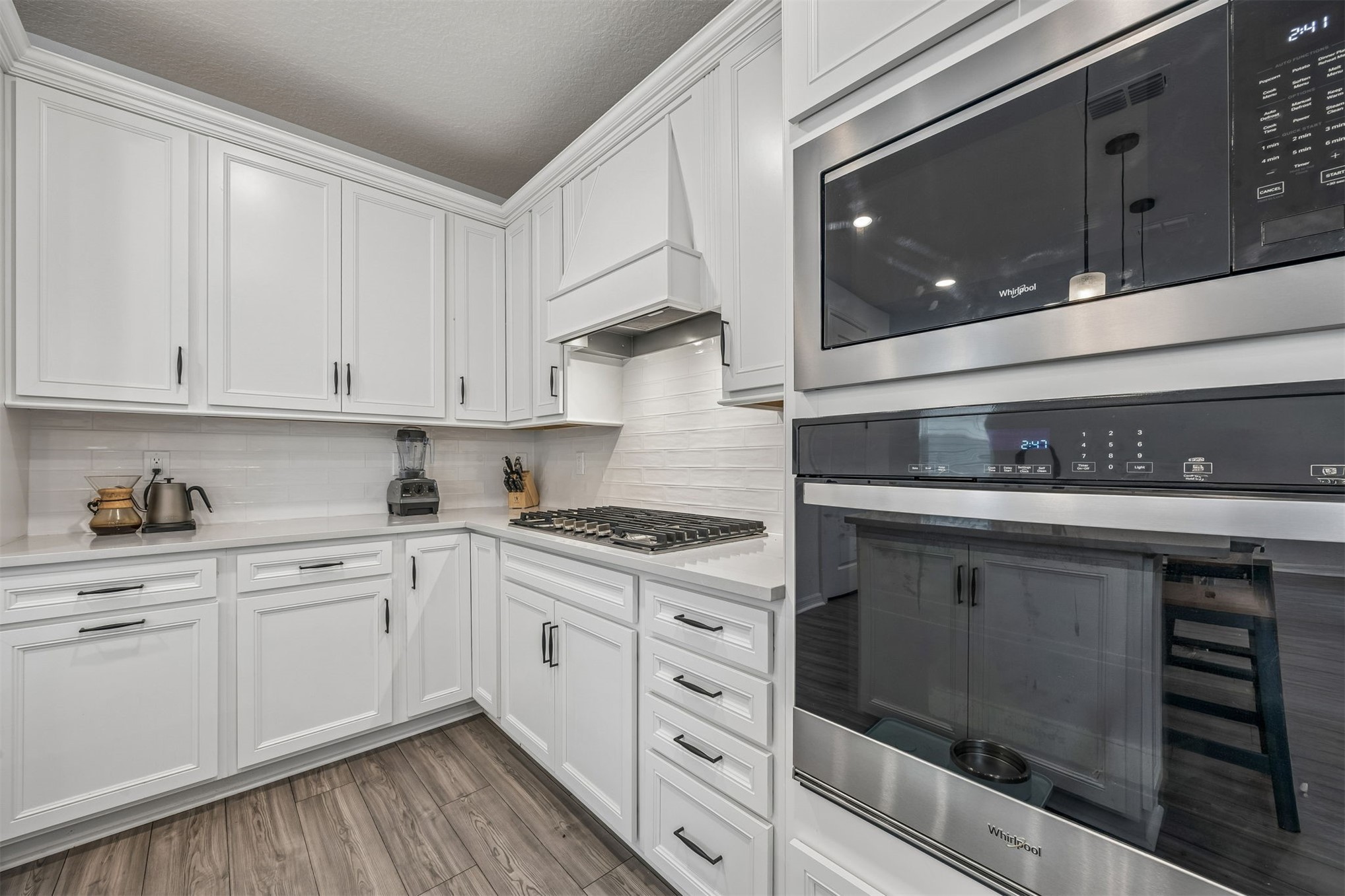 236 Hawthorn Park Circle Yulee, FL 32097 - Photo 8 of 28 a kitchen with white cabinets and appliances