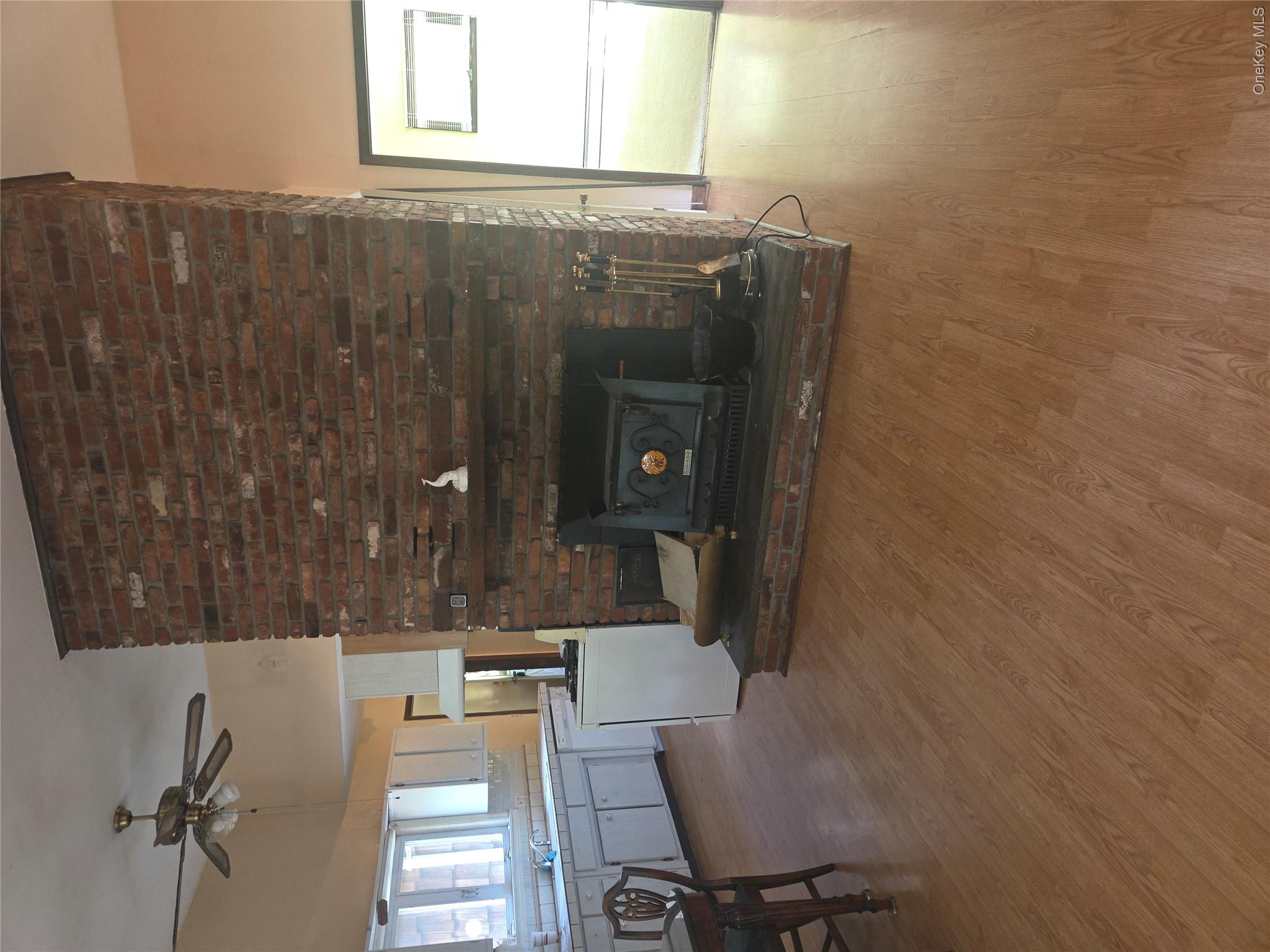 63 Otens Road Ellenville, NY 12428 - Photo 6 of 32 a living room with furniture and a fireplace