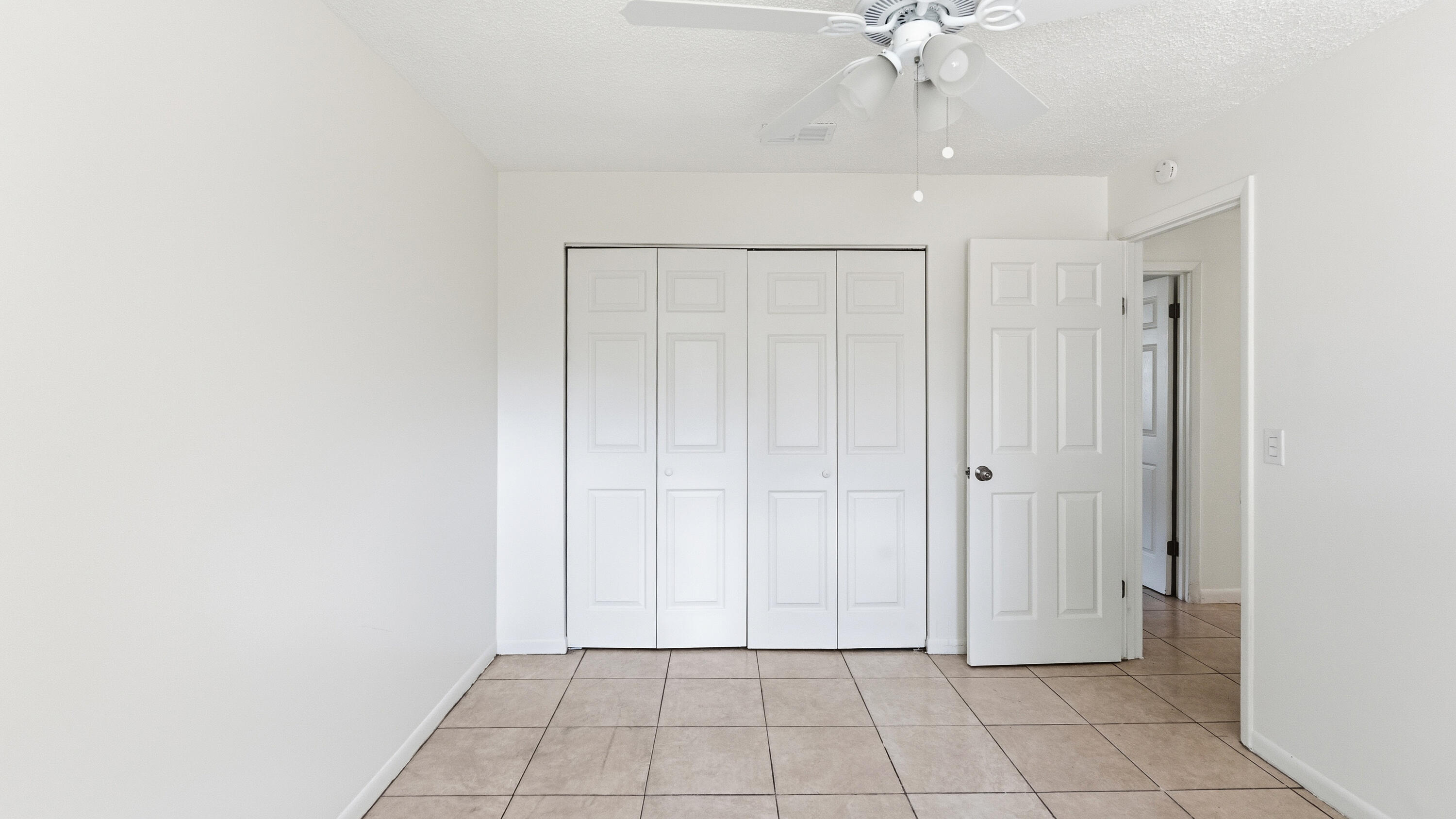 4453 Stevens Road Lake Worth Beach, FL 33461 - Photo 52 of 67 a view of an entryway with chandelier fan
