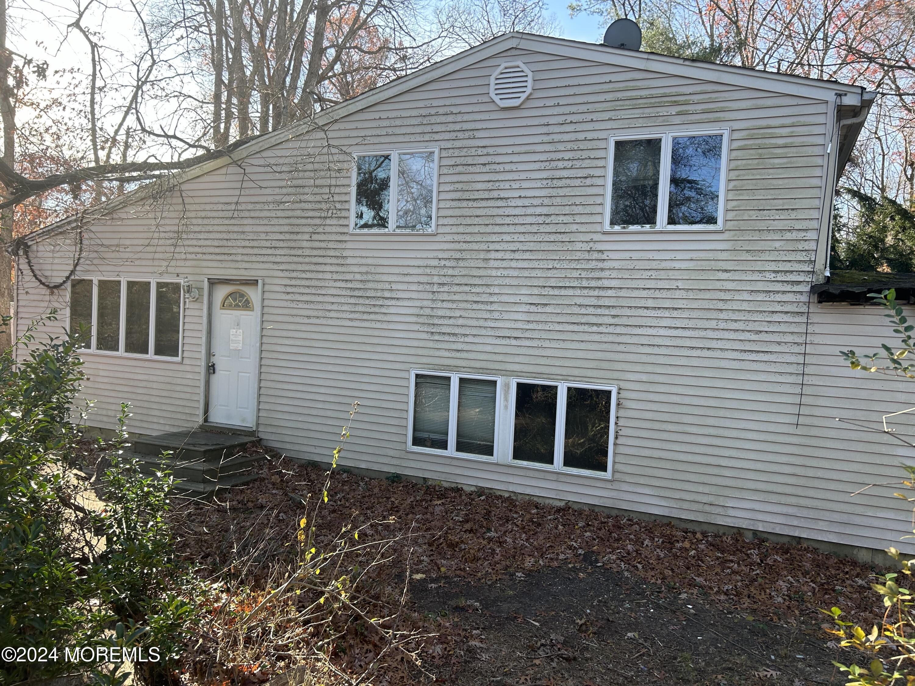 1730 Old Freehold Road Toms River, NJ 08755 - Photo 2 of 2 a view of a house with a yard and a garage