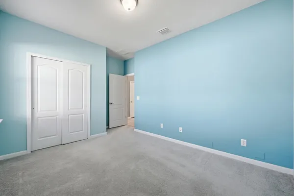 a balcony with table and chairs