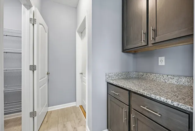 a balcony with table and chairs