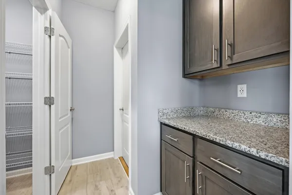 a view of a lake with houses in the back