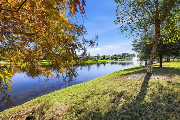 an aerial view of residential houses with outdoor space and swimming pool