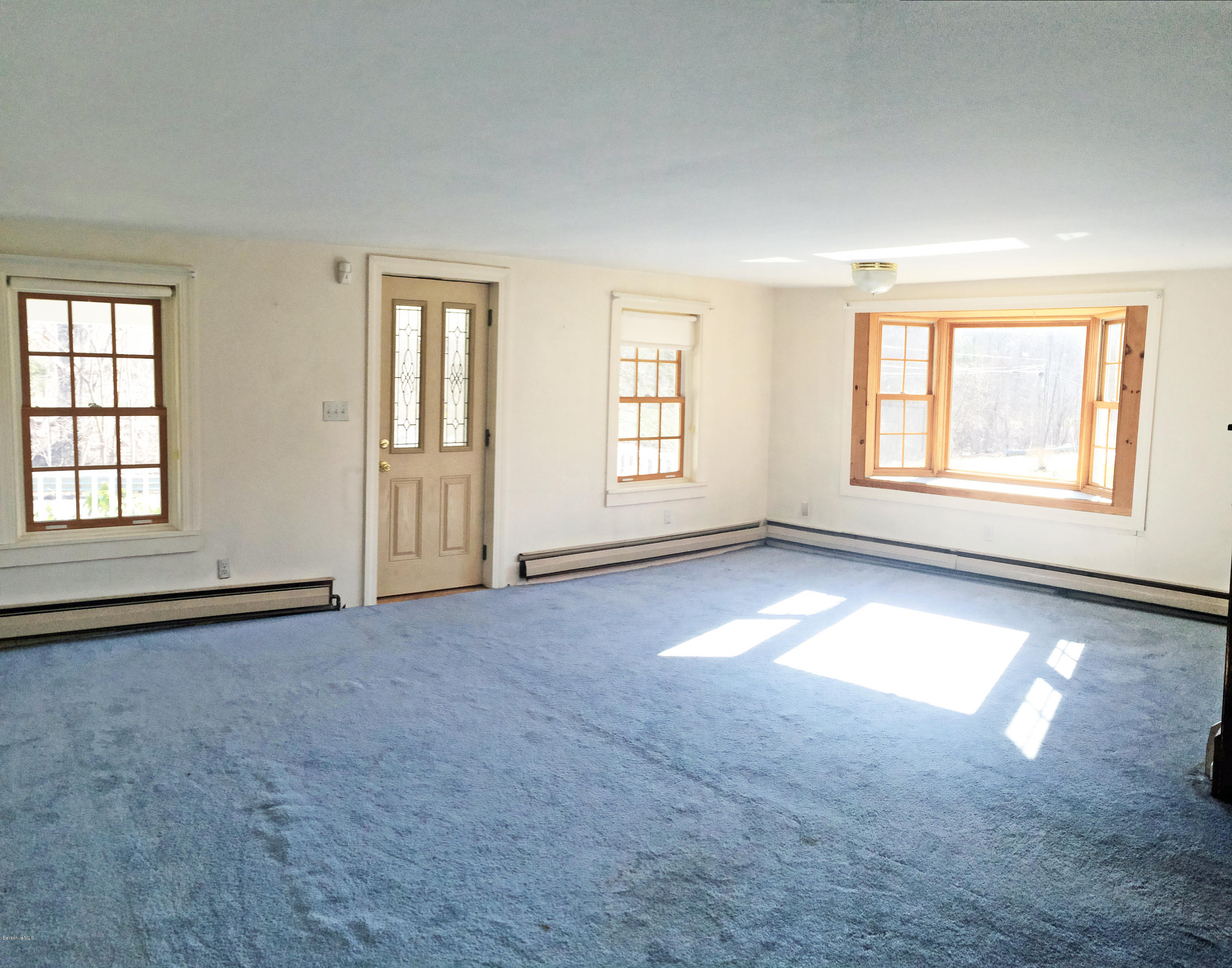 55 Sandisfield Road Sandisfield, MA 01255 - Photo 11 of 20 an empty room with windows