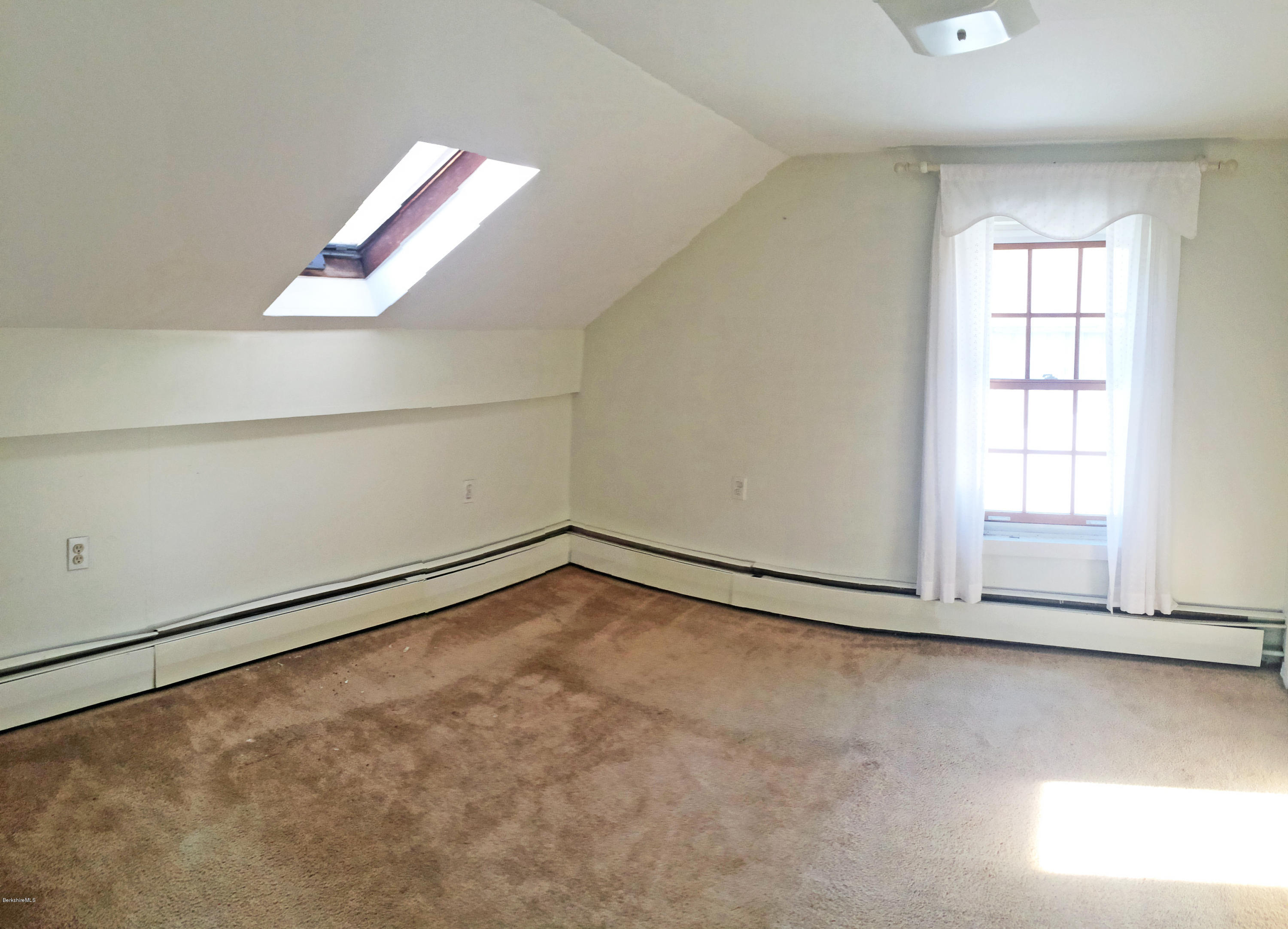 55 Sandisfield Road Sandisfield, MA 01255 - Photo 15 of 20 an empty room with a window