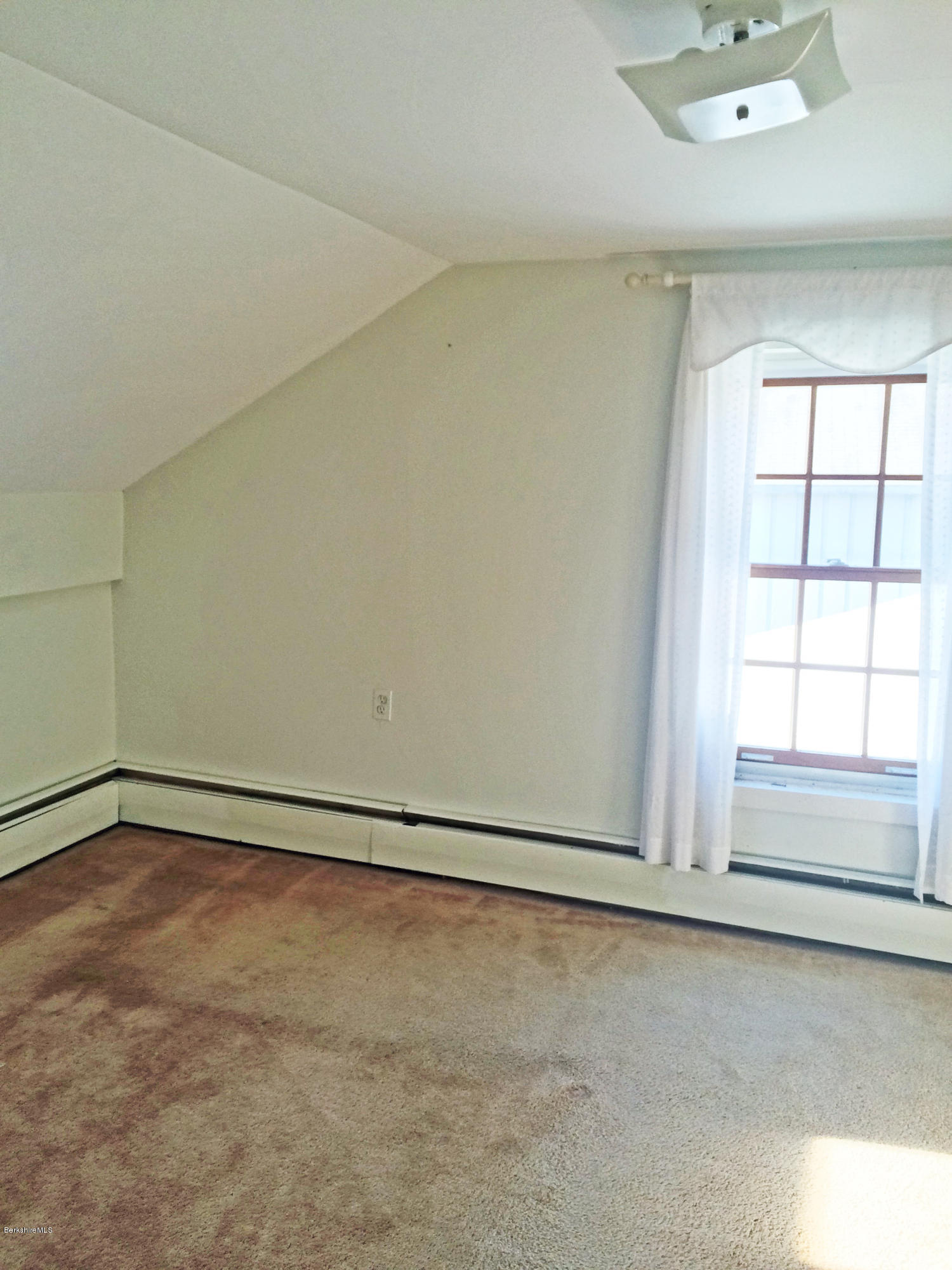 55 Sandisfield Road Sandisfield, MA 01255 - Photo 16 of 20 an empty room with a empty space and windows