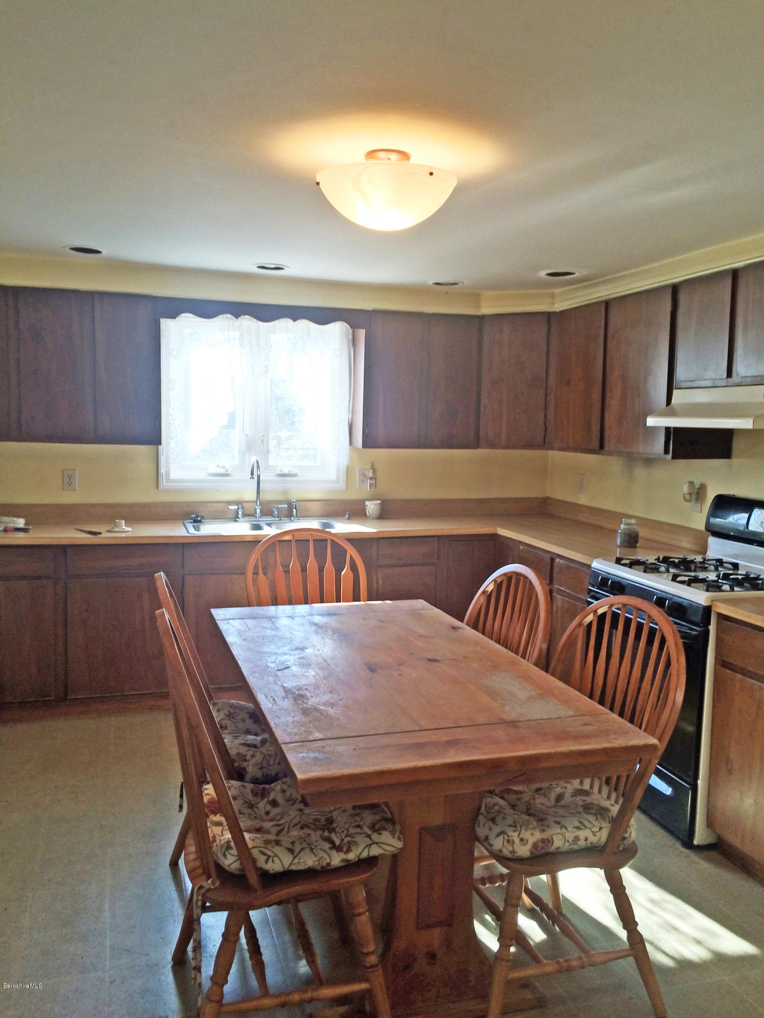 55 Sandisfield Road Sandisfield, MA 01255 - Photo 8 of 20 a view of a kitchen with a table and chairs