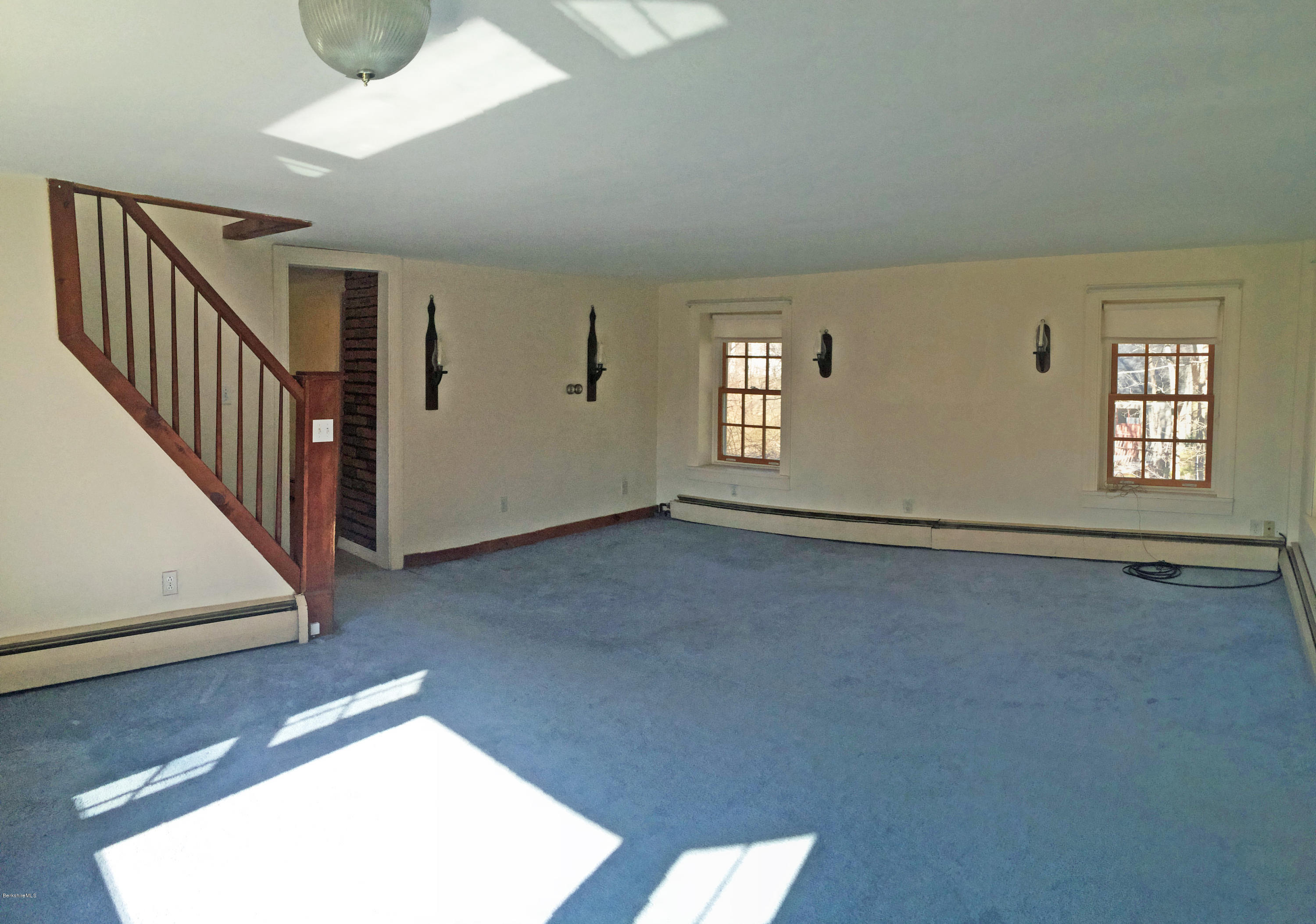55 Sandisfield Road Sandisfield, MA 01255 - Photo 9 of 20 an empty room with windows