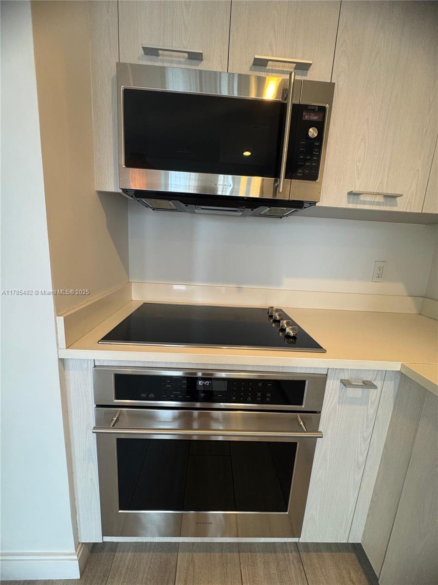 Brickell Miami, FL 33130 - Photo 3 of 12 a stove top oven sitting inside of a kitchen
