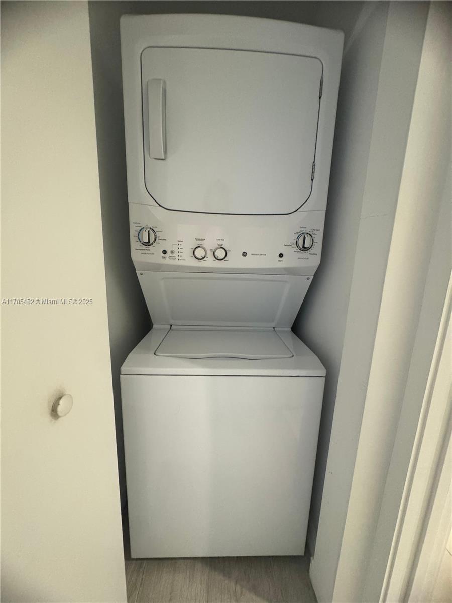 Brickell Miami, FL 33130 - Photo 8 of 12 a utility room with dryer and washer