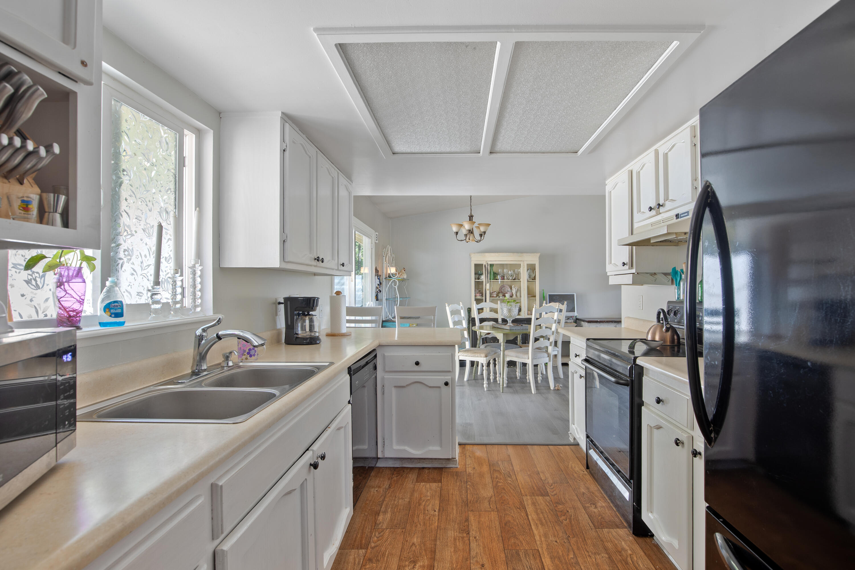12748 Water Gap Road Williams, OR 97544 - Photo 4 of 35 a kitchen with a sink dishwasher stove and refrigerator