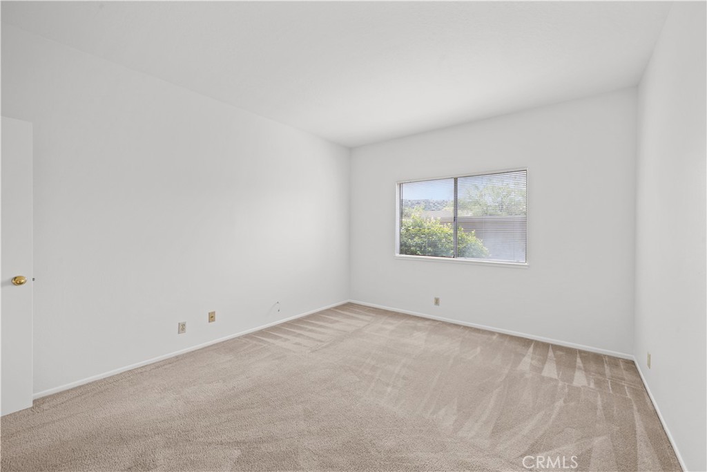27645 Susan Beth Way, Unit A Saugus, CA 91350 - Photo 18 of 26 an empty room with windows