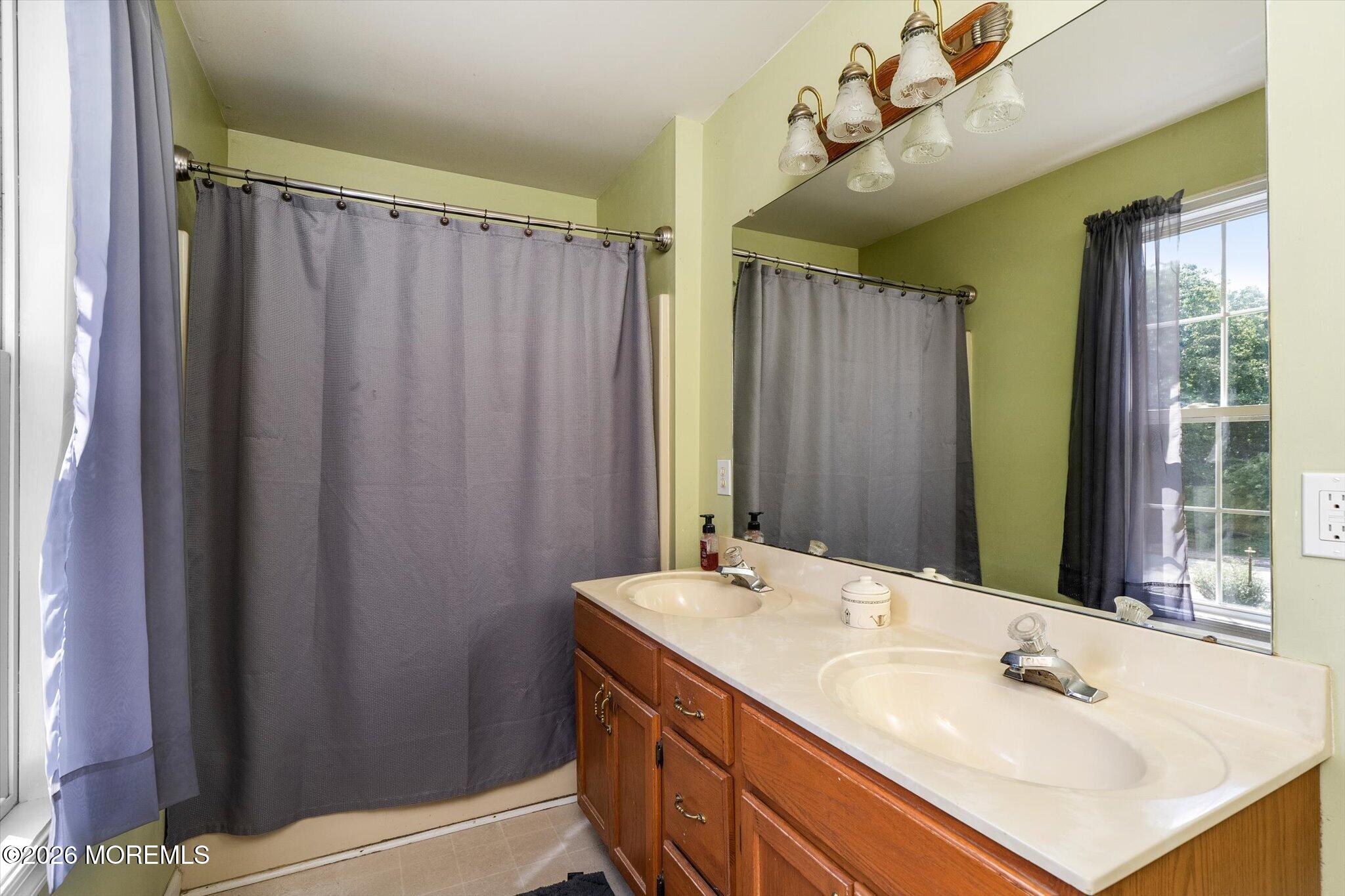 208 North Success Road Cream Ridge, NJ 08514 - Photo 16 of 40 a bathroom with a sink and a mirror