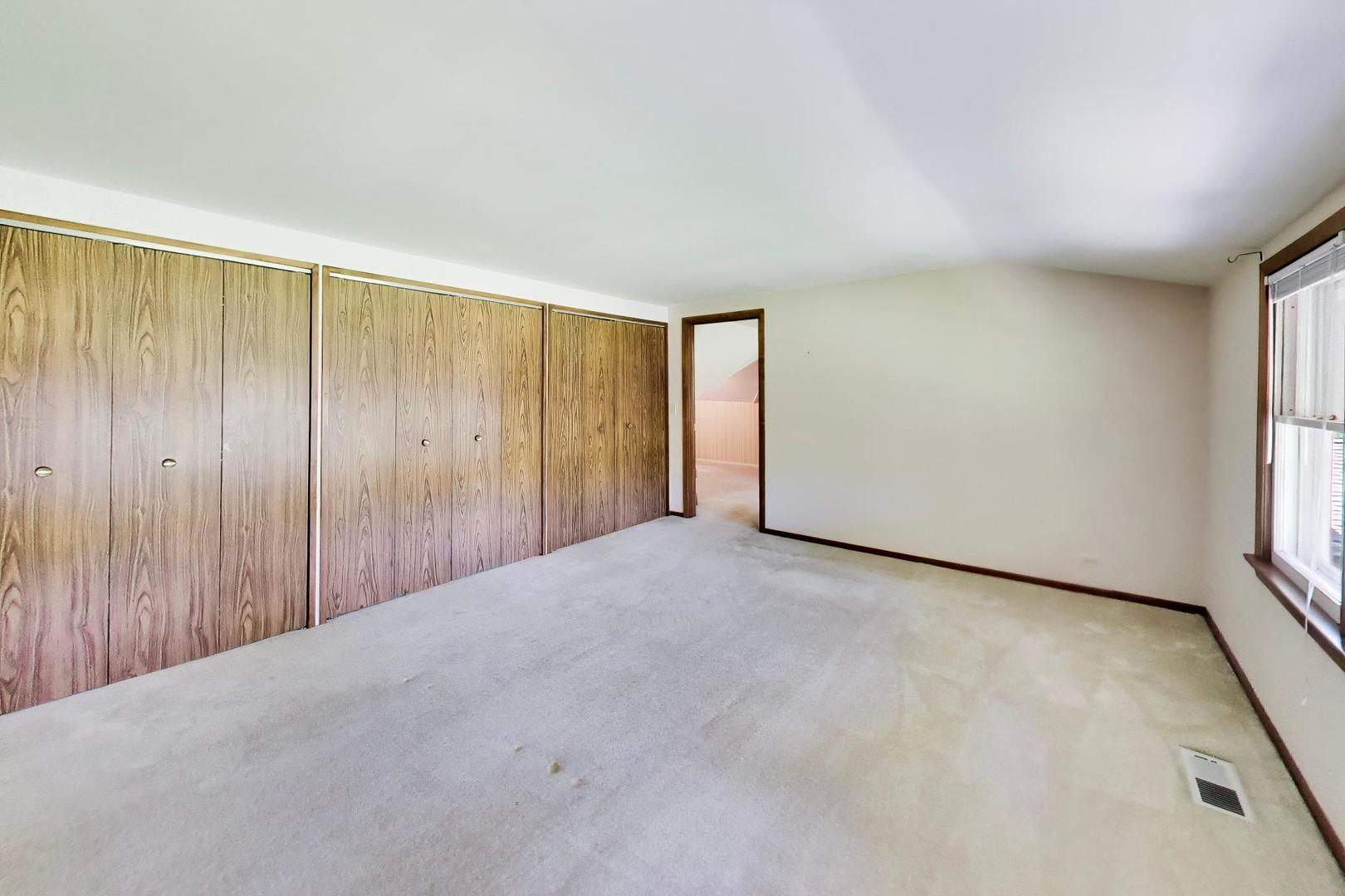 103 Cottonwood Road Northbrook, IL 60062 - Photo 31 of 50 a view of a room with a wooden door