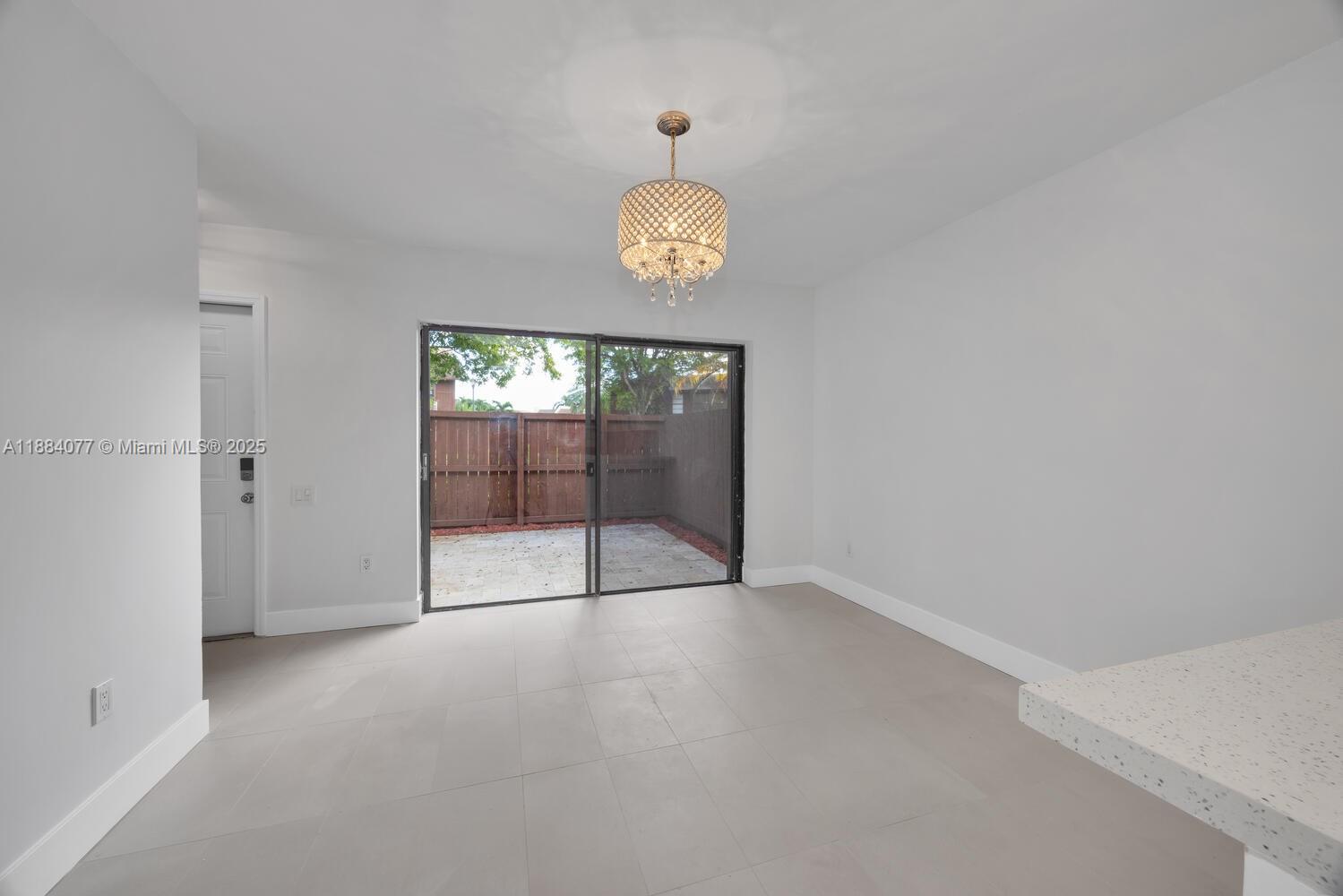 11500 Southwest 64th Street, Unit H Miami, FL 33173 - Photo 13 of 38 a view of an empty room with a window