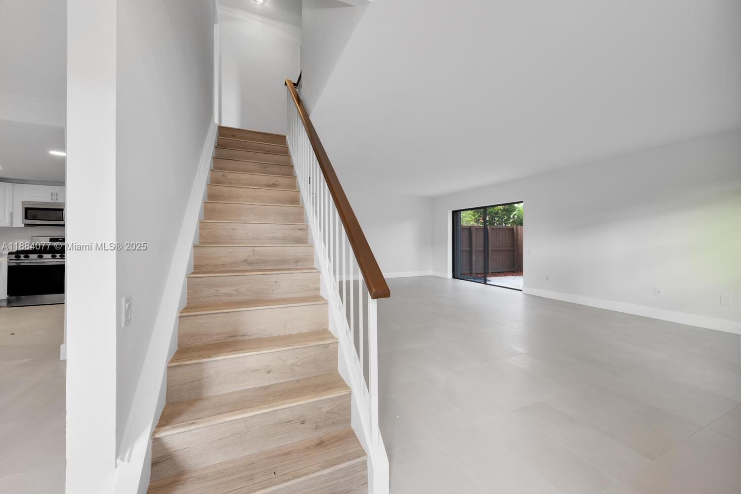 11500 Southwest 64th Street, Unit H Miami, FL 33173 - Photo 20 of 38 a view of entryway and hall with wooden floor