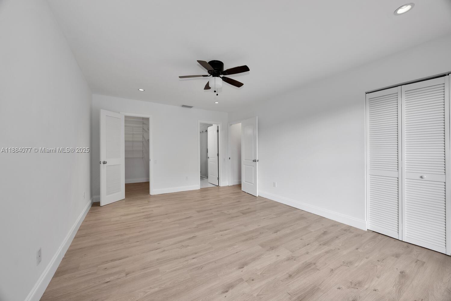 11500 Southwest 64th Street, Unit H Miami, FL 33173 - Photo 24 of 38 a view of an empty room with a ceiling fan