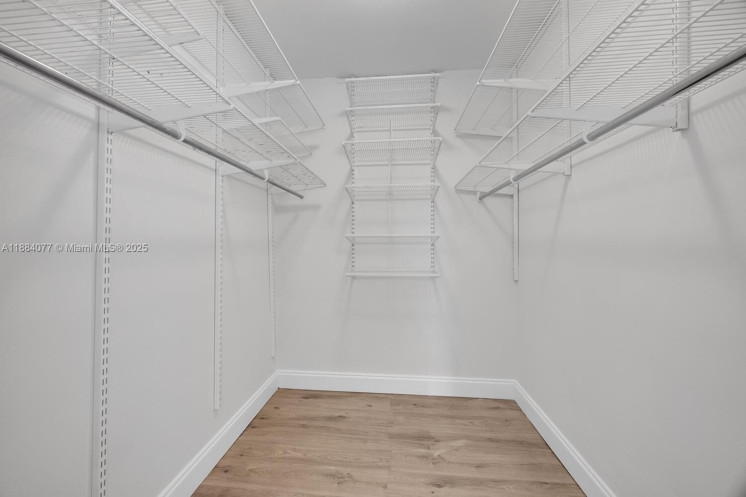 11500 Southwest 64th Street, Unit H Miami, FL 33173 - Photo 25 of 38 a view of a room with racks on the wall