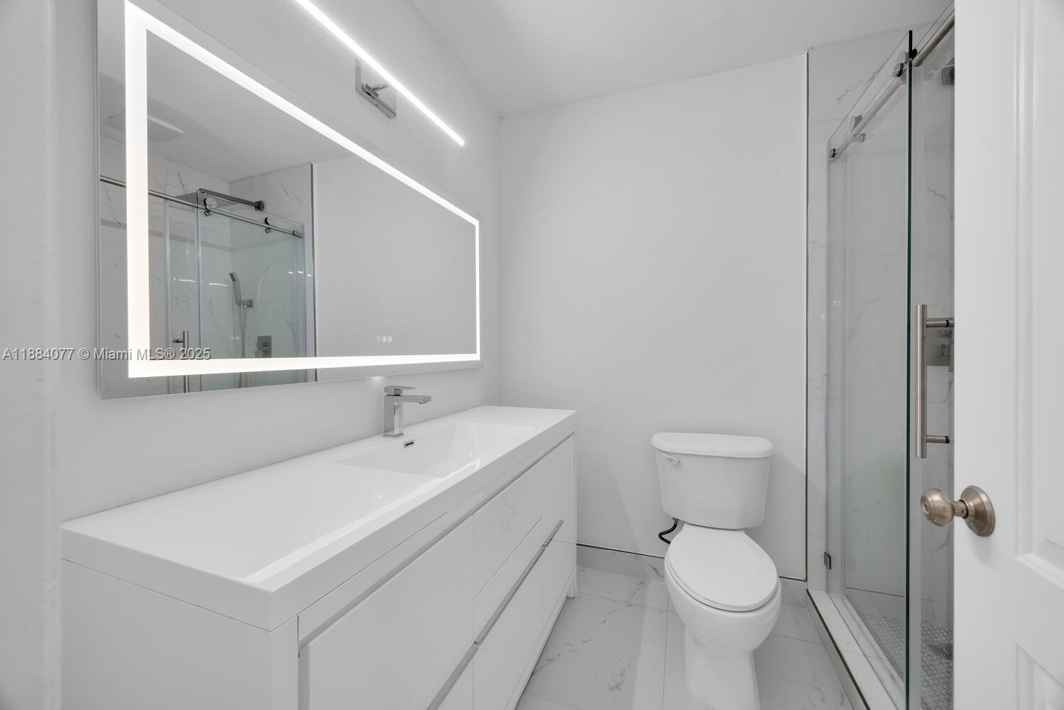 11500 Southwest 64th Street, Unit H Miami, FL 33173 - Photo 26 of 38 a white toilet sitting next to a bathroom sink