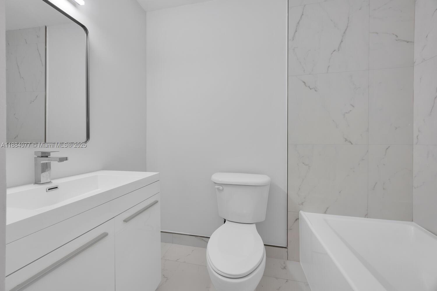 11500 Southwest 64th Street, Unit H Miami, FL 33173 - Photo 29 of 38 a white toilet sitting next to a bathroom sink