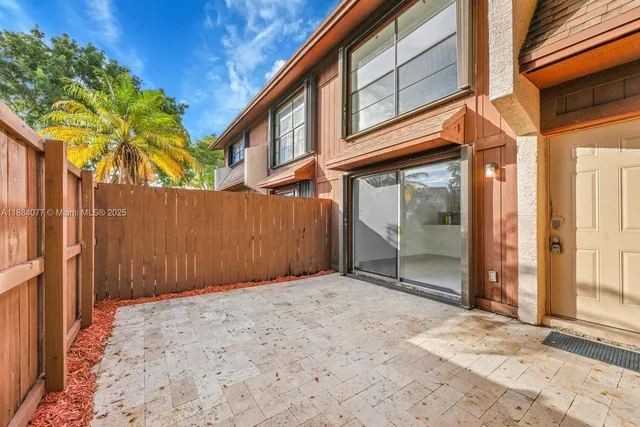 a view of a house with a tree