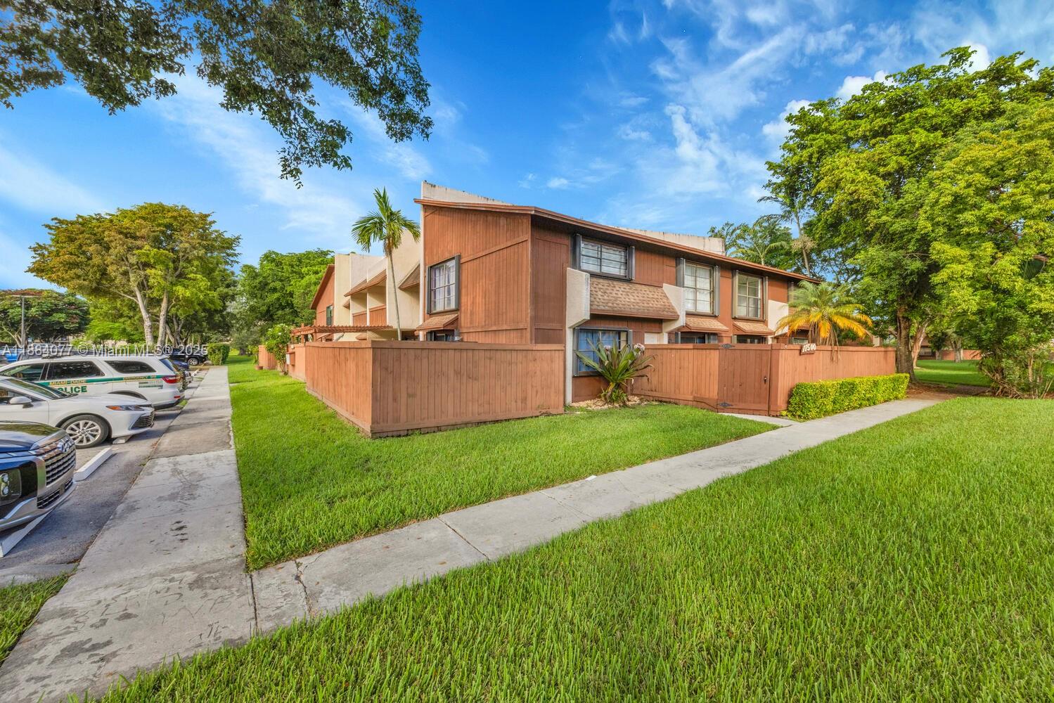 11500 Southwest 64th Street, Unit H Miami, FL 33173 - Photo 32 of 38 a view of a backyard with a garden and plants