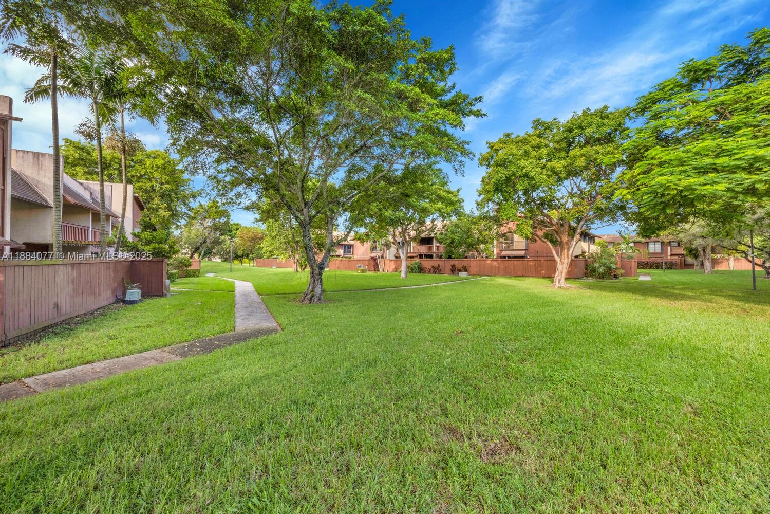 11500 Southwest 64th Street, Unit H Miami, FL 33173 - Photo 33 of 38 a view of a park with large trees