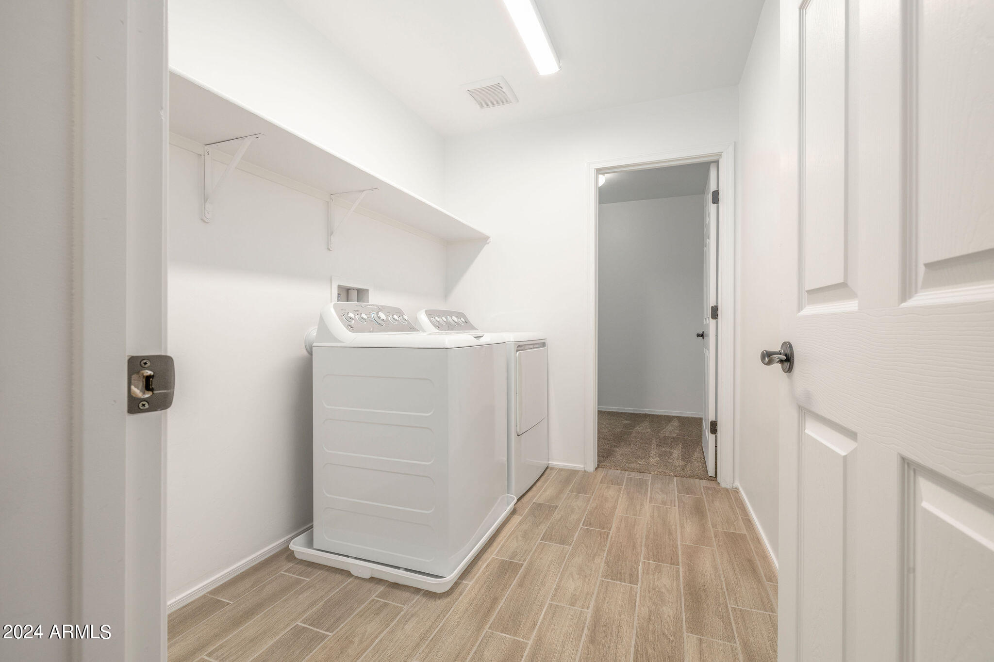 6593 East Via Arroyo Largo Tucson, AZ 85756 - Photo 23 of 57 Upstairs Laundry + Storage Room