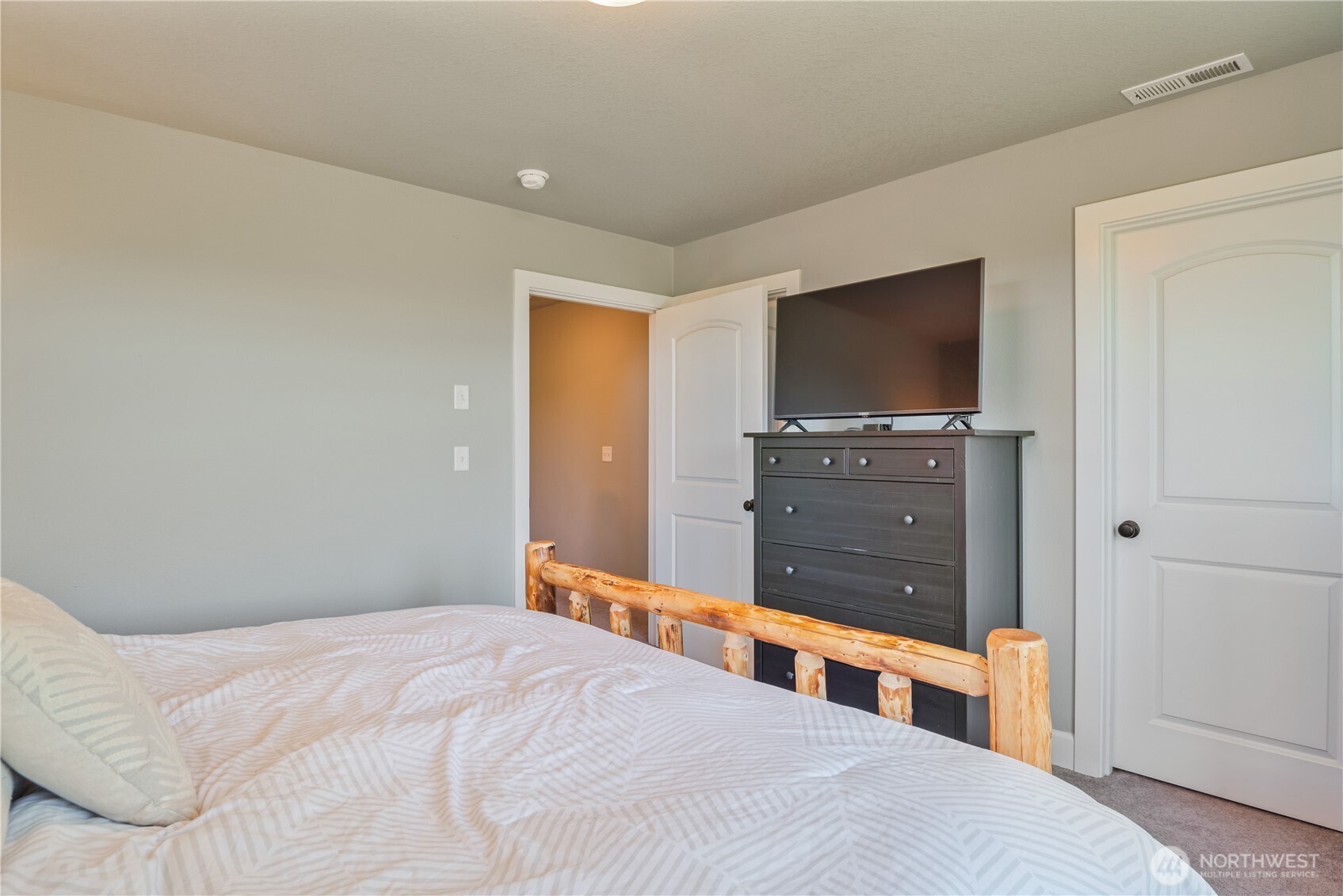 327 Parpala Road Naselle, WA 98638 - Photo 16 of 36 a bedroom with a bed and a flat screen tv