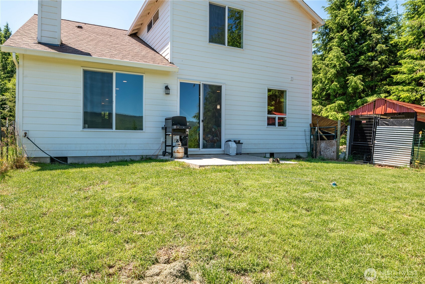 327 Parpala Road Naselle, WA 98638 - Photo 28 of 36 a view of house with yard outdoor seating area and garage