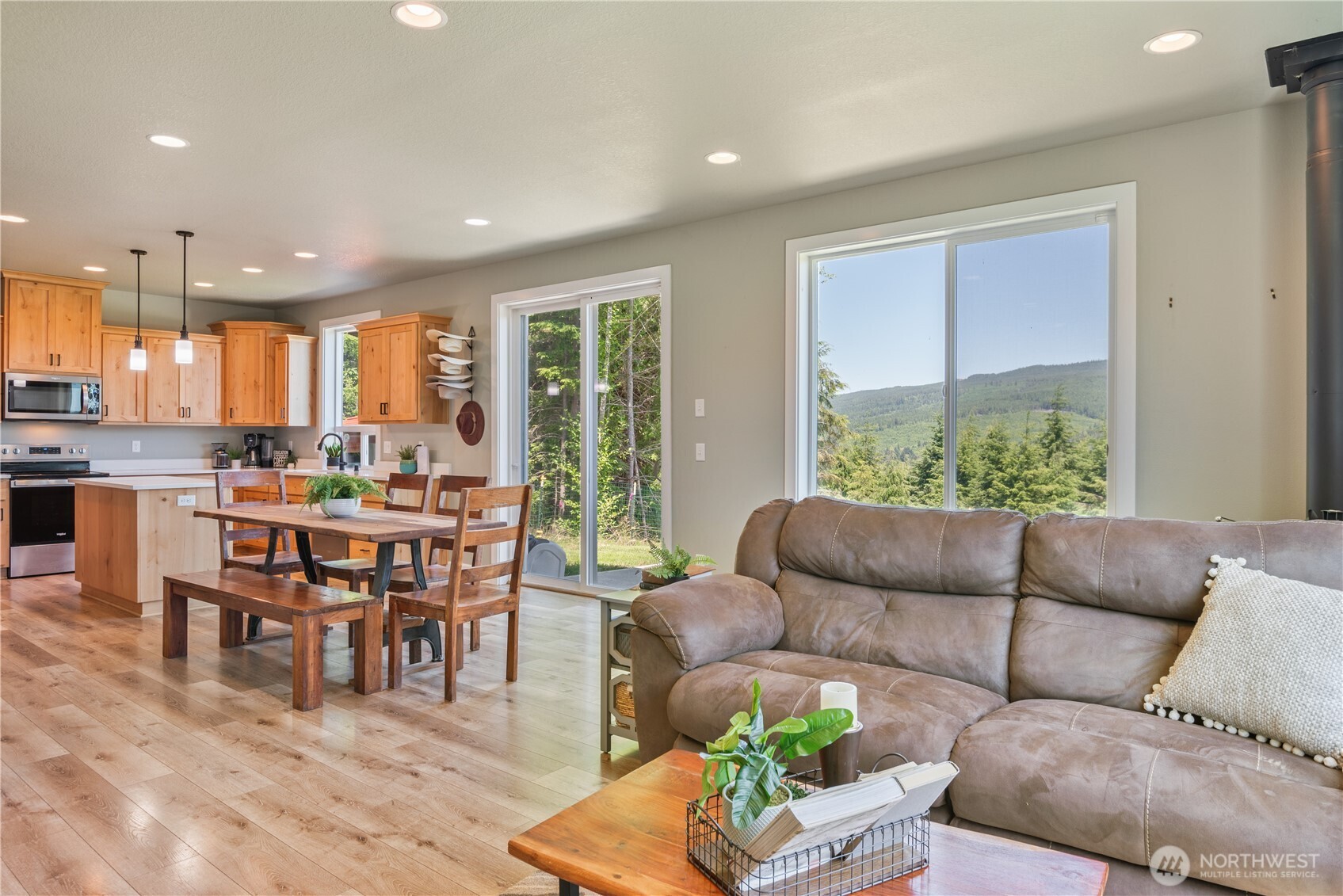 327 Parpala Road Naselle, WA 98638 - Photo 9 of 36 a living room with furniture and a large window