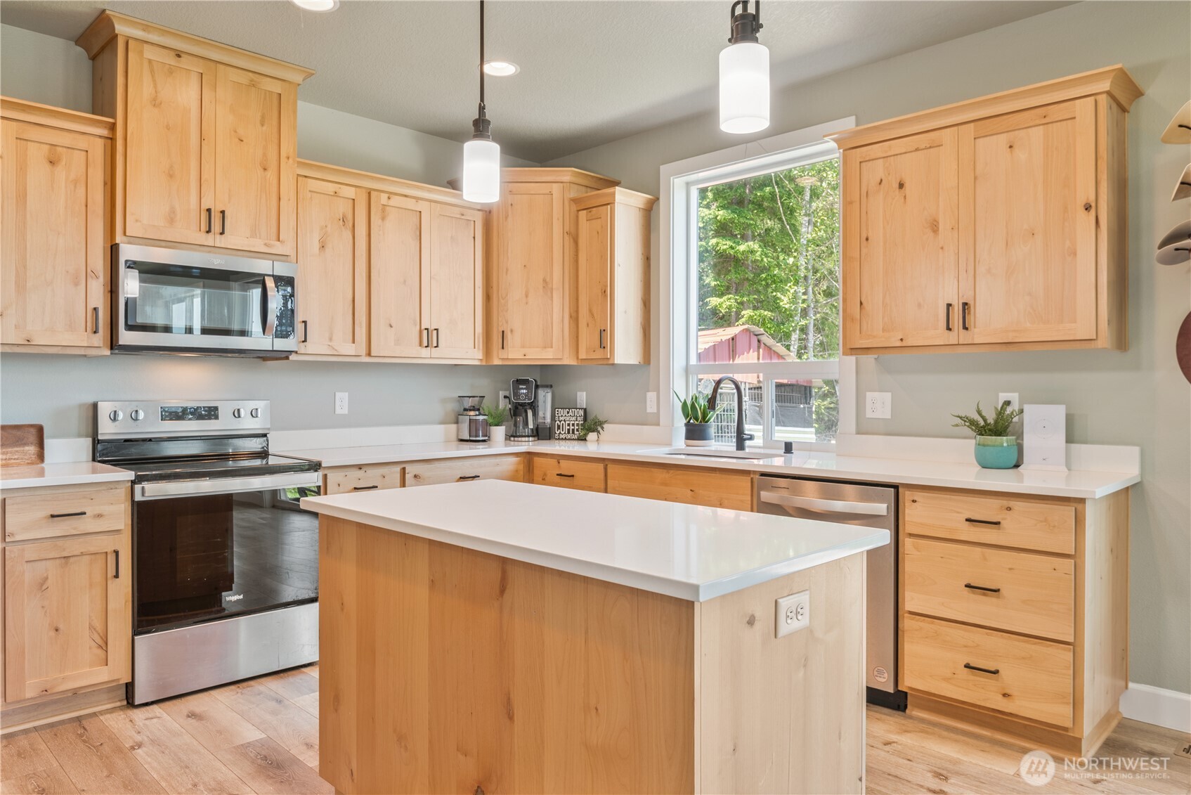 327 Parpala Road Naselle, WA 98638 - Photo 10 of 36 a kitchen with stainless steel appliances granite countertop a stove sink and cabinets