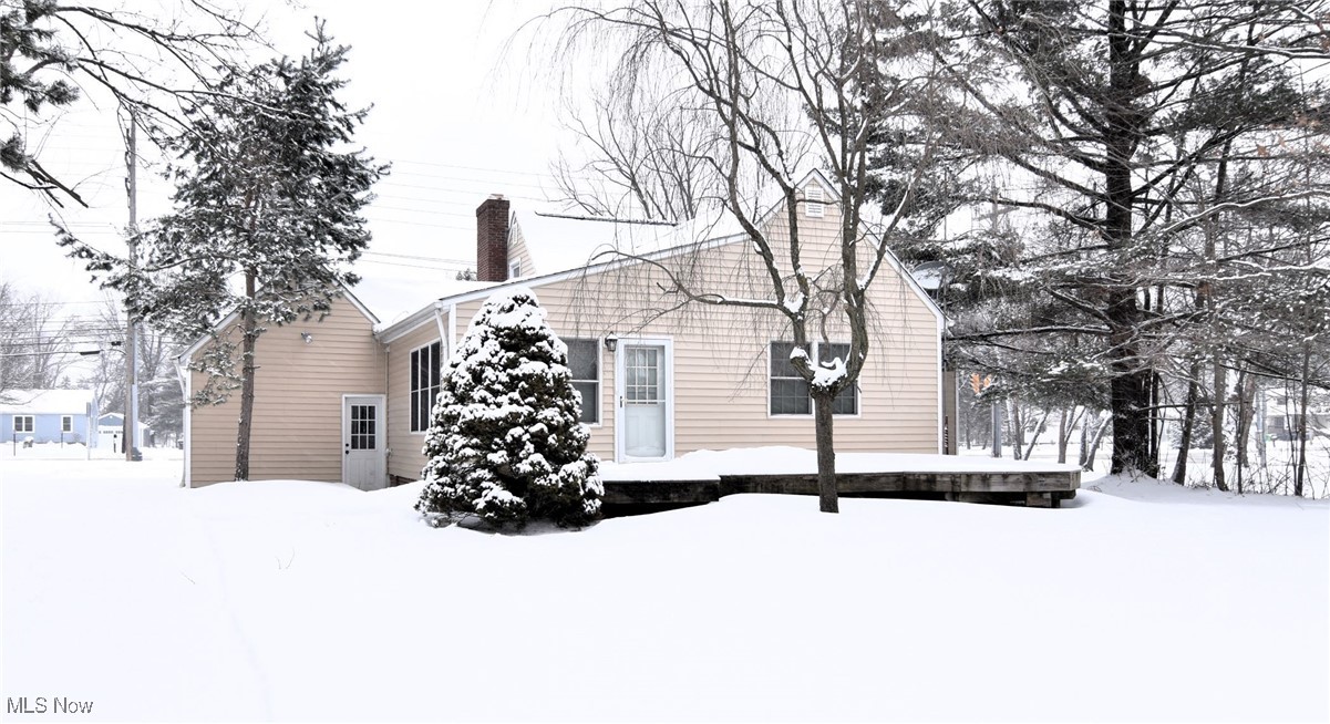 6308 Highland Road Cleveland, OH 44143 - Photo 39 of 40 View of snowy exterior with a chimney