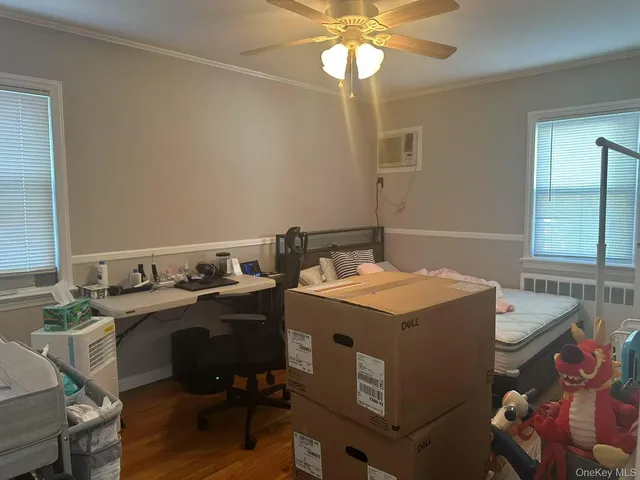 a view of a workspace with furniture and chandelier