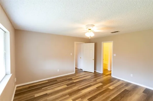 a view of a room with a ceiling fan