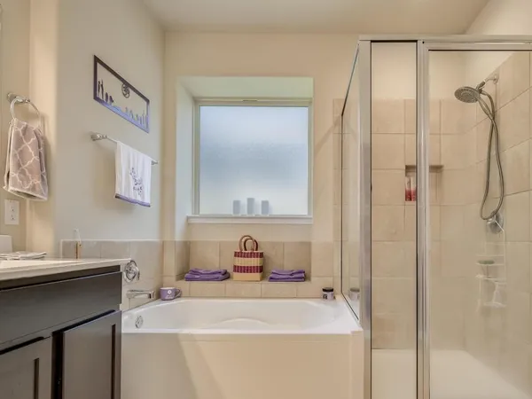 a bedroom with a bed and couch