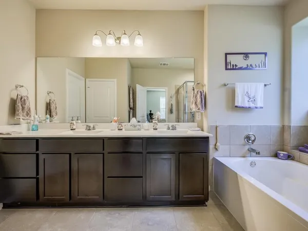 a bedroom with a bed and dresser