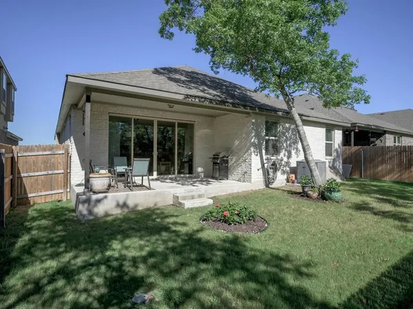 a view of walk in closet with clothes