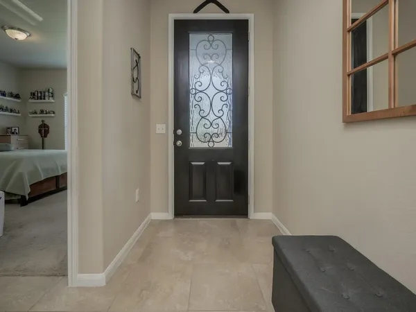 a view of hallway with closet and bathroom
