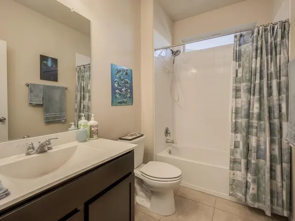 a dining hall with stainless steel appliances granite countertop a sink and dishwasher with wooden floor