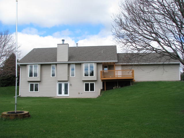 9591 Rambouillet Ridge Roscoe, IL 61073 - Photo 18 of 19 a view of house with yard and car parked