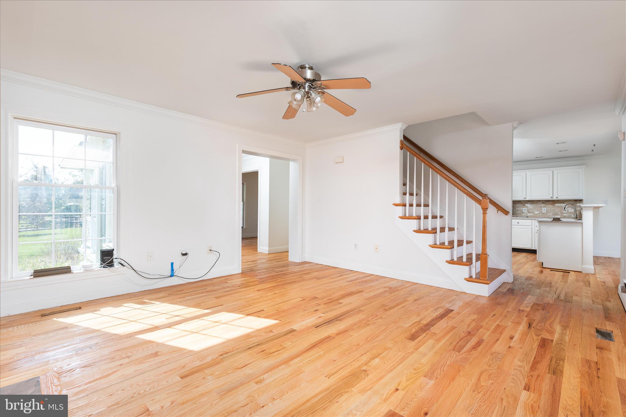 1200 Salem Church Road Stephens City, VA 22655 - Photo 8 of 69 a view of a livingroom with wooden floor and a ceiling fan