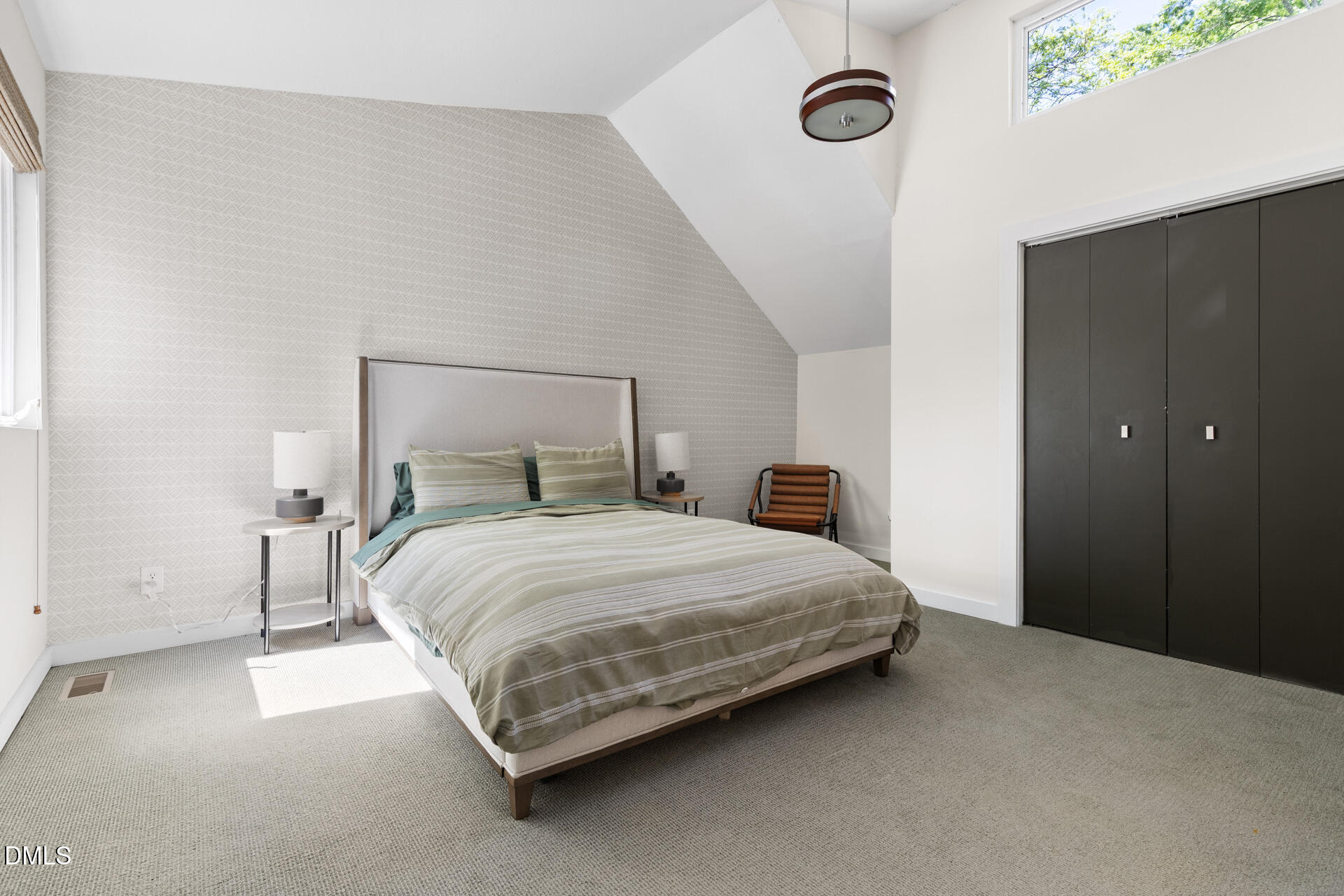 5208 Saddle Court Raleigh, NC 27609 - Photo 36 of 43 a bedroom with a bed and a mirror