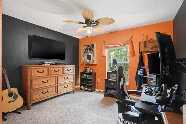 a view of a livingroom with furniture and a flat screen tv