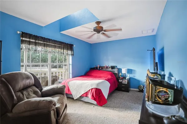 a bedroom with furniture and a window