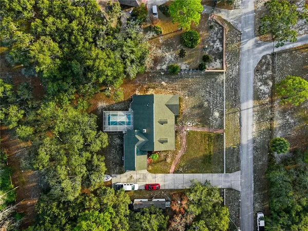 an aerial view of a residential houses with city view