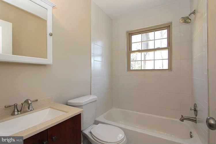 8817 Walnut Hill Road Chevy Chase, MD 20815 - Photo 14 of 26 a bathroom with a sink toilet and bathtub