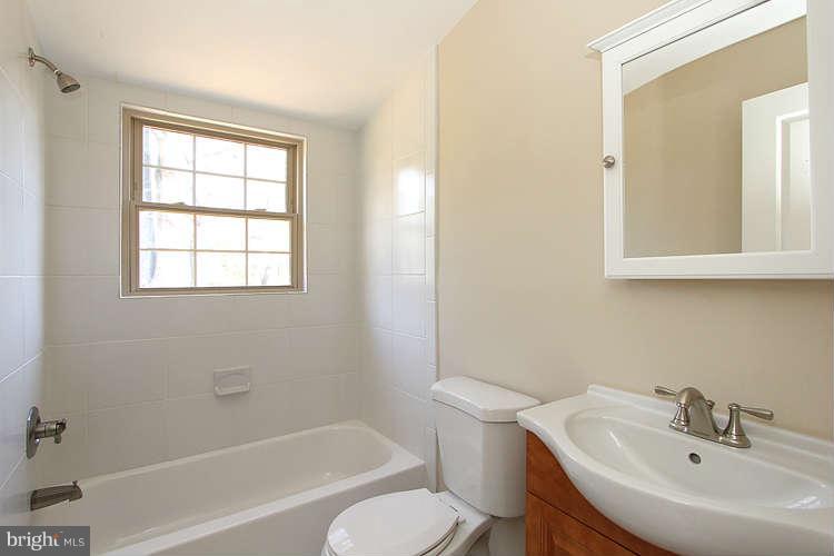 8817 Walnut Hill Road Chevy Chase, MD 20815 - Photo 17 of 26 a bathroom with a sink toilet and bathtub