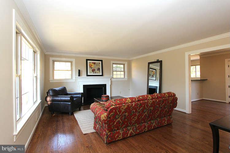 8817 Walnut Hill Road Chevy Chase, MD 20815 - Photo 3 of 26 a living room with furniture fireplace and flat screen tv
